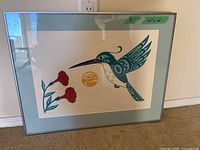 Full front view of framed print showing hummingbird and flowers