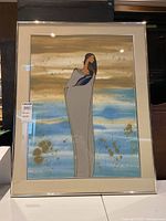 Full view of framed serigraph Genesis by Loyan Mani showing the Indigenous figure and background