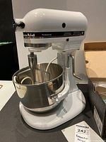 Front view of white KitchenAid Professional stand mixer with bowl attached