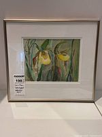 Frontal view of framed watercolour painting of ladyslippers showing entire artwork and frame.