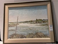 Full view of the framed landscape painting showing marsh, water, and trees under a sky.