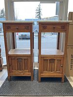 Pair of oak side tables displayed side by side showing front view
