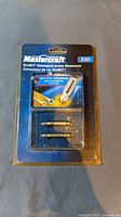 Front view of Mastercraft GrabIt damaged screw remover 2-piece set in original packaging with two metal extractor bits.