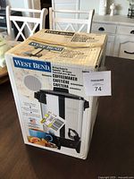 Box of West Bend 30 Cup Coffee Maker showing branding and specifications.