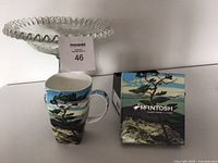 Photo showing the McIntosh china mug with original packaging and the glass pedestal bowl behind it.
