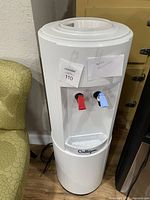 Front view of the white Culligan water cooler with red and blue dispensing taps, showing overall condition and design.