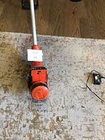 Black & Decker weed whacker top view showing trimming head and shaft.