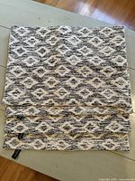 Stack of four Cynthia Rowley kitchen towels with consistent black and white geometric pattern.