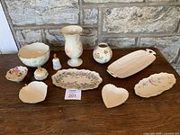 Full collection of 10 assorted Lenox porcelain pieces with variety of shapes, floral designs and pastel colors.