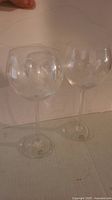 Two clear wine goblets side by side showing overall shape and size.