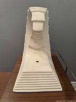 Front view showing layered wave pattern and wiring hole.