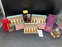 Complete view of the entire fragrance collection including miniature boxed sets, vintage bottles, and boxed Elizabeth Arden bottle.