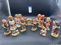 Full set of vintage Erich Stauffer figurines displayed around the clock.