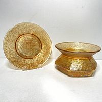 Both the carnival glass spittoon and decorative plate shown side by side on white background