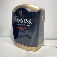 Front view of the Guinness Draught tap light showing the main logos and design.