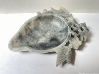 Soapstone brush washing dish top and angled view showing gourd shape and floral carvings.