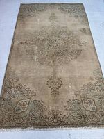 Full view of rug laid flat showing overall design and condition