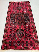 Full view of hand knotted Balouch Persian rug laid flat on floor