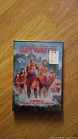 Front cover of Baywatch DVD showing main cast in lifeguard uniforms.