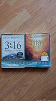 Front view of the two DVDs in the set showing the titles and authors Max Lucado and Lee Strobel.