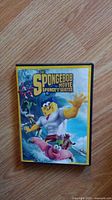 Front cover of The SpongeBob Movie: Sponge Out of Water DVD case featuring SpongeBob and Patrick in superhero poses against an ocean background.