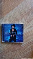 Front cover of Fearless CD album by Terri Clark on wooden floor