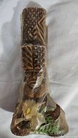 Front view of the CocoJoes Kanaloa Eternal Tiki God Figure wrapped in plastic showing detailed head carving and upper body.