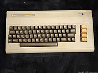 Full front view of the Commodore 64 keyboard showing the layout and condition.