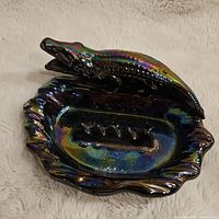 Top and angled view of the vintage iridescent alligator ashtray showing details of the alligator and ashtray base.