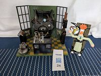 Full lab set with Beaker figure and backdrop, showing the lab equipment and Beaker tied to the post.