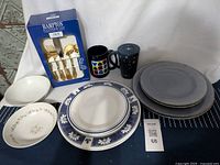 Photo of bowls, plates, mugs, and boxed 20-piece Hampton Silversmiths utensil set, showing variety and condition of dinnerware and flatware items