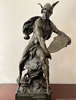 Front view of full sculpture on wood surface