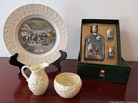 Overall view of Adams collector plate on stand, Belleek cream pitcher and sugar bowl in front, and Holmegaard decanter and two dram glasses in original box.