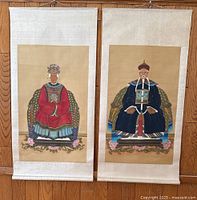 Pair of vintage Chinese ancestor scroll paintings on silk displayed side by side showing full length and details.