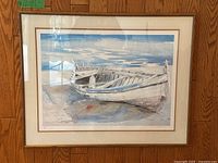 Full framed watercolor print showing an old wooden boat on a beach with blue sky reflections in water.