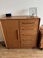 Front view showing left cabinet door, right drawers, top surface