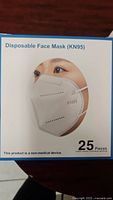 Front and side view of mask packaging showing mask type KN95 and quantity (25 pieces).