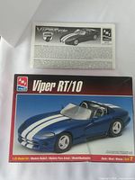 AMT Viper RT/10 box and instruction manual showing front artwork and logo