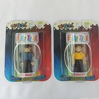 Photo showing both Dr. McCoy and Captain Kirk Mini Mates figures in original packaging, new and sealed.