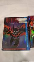 Photo of Batman Beyond Season 2 DVD box set showing cover art and episode count with sticker residue on front