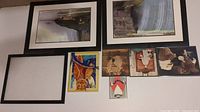 View of two Niagara Falls prints and five smaller prints/pictures including an empty frame