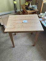 View of the rectangular top surface of the natural wood end table, showing smooth finish and wood grain details.