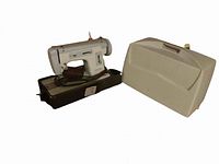 Singer Merritt Capri 219 sewing machine with its hard plastic cover removed, showing the machine on its base with power cord and foot pedal management.