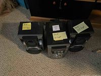 Sony mini hi-fi stereo system showing central unit and two speakers with dimension notes on sticky notes