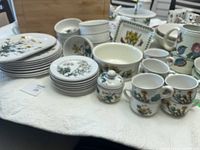 Full lot view showing stacked dinner and dessert plates, bowls, cups, saucers, plus serving pieces.