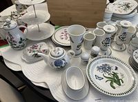 Front view of dinnerware and serveware arranged on table