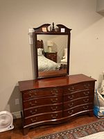 Full front view of dresser and mirror against wall