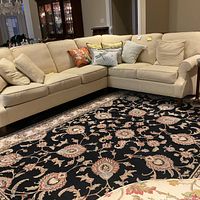 Main front view of the L-shaped sectional with all cushions and pillows in place