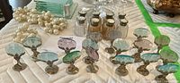 Overhead view of all items including place card holders, salt and pepper shakers, candle holders, coasters and napkin rings