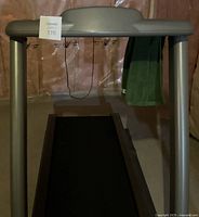 Photo of Vision Fitness treadmill from a front angle showing the treadmill's running belt and control panel.